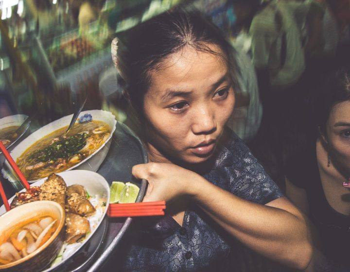 Professional photographer Vietnamese woman delivers great food