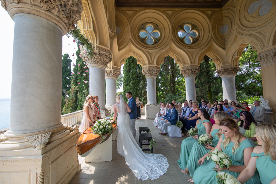Professional wedding photographer. Exchange of wedding vows on the Garda island, photo by glpstudio